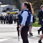 Armed police escort students from the grounds of Bayfield High School which was closed after an...