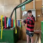 Corey Miller, 16, of Alexandra, works on the Leaning Rock Cafe Eat Humble Pie float. PHOTOS:...