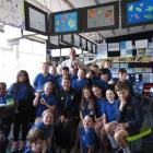 Oympic medallist Nicole Shields with teacher Alistair Banks and his class of Clyde Primary School...