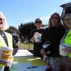 Palmerston St John volunteers Sonya Watson (left) and Philippa Sutherland (right) drum up funds...