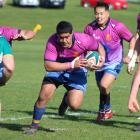 North Otago No 8, Kasimila Vaihu, charges towards the line at Weston on Saturday. PHOTO: KAYLA HODGE