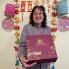 Oamaru Chinese Association president Janice Burnett presents mooncakes as a traditional food of...