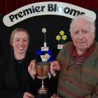 Hayley Lawrence and her grandfather Ray Lawrence hold the champion vase Margaret Clark Cup,...