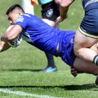 James Hickey goes over for a try for the Auckland Vulcans against the Otago Whalers on Saturday....