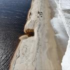 Environment Southland contractors were busy yesterday opening the Waituna Lagoon to the sea....