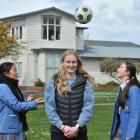 Southern United defender Hannah Mackay-Wright helped guide her Queen’s players Yui Ishikawa, 16, ...