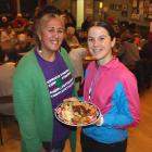 Food fundraiser . . . Gathering for a meal are Araiteuru Marae manager and Pātaka Ora host Tania...
