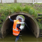 A Waikato Regional Council officer inspecting stock underpass. Photo: Waikato Regional Council