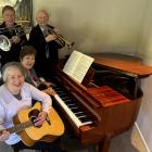 Ashburton Musical Club chair Janice Allen (foreground), committee member Carolie Andrew,...