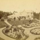 One of the photos stolen recently from Balclutha Museum, showing a Victorian house and garden in...