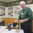 Wahi Kahuika Owaka Museum manager Mike McPhee shows off a tūwiri (cord drill) as one of the items...