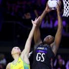 Silver Ferns shooter Grace Nweke takes the ball under the pressure of Diamonds defender Jo Weston...
