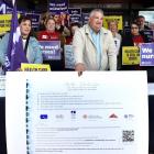 Patient advocate Malcolm Mulholland shows off the "Buller Declaration", which outlines key...