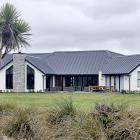 Much of  the lawn area in front of James and Sarah Murray’s house on Gardiners Rd is part of the...