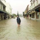 Queenstown’s Alec McGregor pictured in Beach St during the 1999 flood. PHOTO: ARCHIVE
