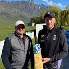 Joe Root, right, with bat owner Donald Jackson after adding his signature in Queenstown last...