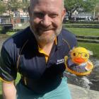 Rotary duck race organiser Tim Wilshire with Mountain Scene’s corporate duck last year — a...