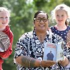 Dunedin artist Ana Teofilo displays the New Zealand School Journal she features in while Halfway...