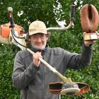 Task Force Green volunteer David Robins holds The Pod trophy he was awarded at the Keep Dunedin...