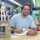 Rugby legend Sam Whitelock signing his new book in Gore Paper Plus last Wednesday. PHOTO: GERRIT...