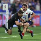 All Black Beauden Barrett tackles French rugby superstar Antoine Dupont. PHOTO: GETTY IMAGES