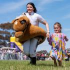 Former Wingatui jockey Jaylah Kennedy joins in the fun with youngsters at a race meeting in St...