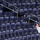 A New York Yankees fan reacts in the stands after his team was beaten by the Los Angeles Dodgers...