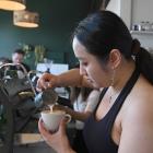 Barista Ruoling Chen competes in the Dunedin latte art throw down competition at Strictly Coffee...