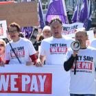 Dunedin mayor Jules Radich (centre) joined thousands of people protesting cuts to the new Dunedin...