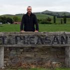 Mt Pleasant co-owner Rogan Borrie stands at the entrance of the sheep and beef farm he bought in...