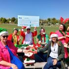 Celebrating a funding boost for community Christmas dinners are (from left) Teressa May, of...
