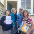 Preparing for their upcoming pop up art gallery are (from left) Sandra Kelly, Diana Peneamene,...
