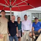 From left, venue manager Tim Yunussov, co-owner Cam Mitchell, store manager Erica Wymore, local...