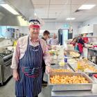 Executive Judge Stephen O’Driscoll minds the potatoes at the Salvation Army Christmas lunch....