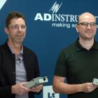 ADInstruments co-founder Michael Macknight (left) and chief executive Alex Black hold PowerLabs ...