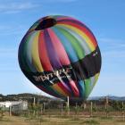 A balloon comes in for a hard landing at Queensberry yesterday morning. Inset: Passengers brace...