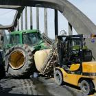 Wide load ... A dual-wheel tractor awaits removal following an accident on the Balclutha Bridge,...