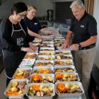 Helping to prepare 80 roast meals last week are (from left) Silver Fern Farms Finegand site...