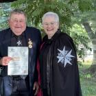 Roxburgh St John member Doug Dance receiving his 65-year service award from St John Southland...