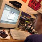 A New York University student downloads music from the Napster site in March, 2001. PHOTO: GETTY...