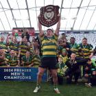Green Island captain Heath MacEwan holds the Trophy after winning the Dunedin premier club rugby...