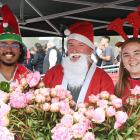 Janefield Peonies and Hydroponics stall operators (from left) Mueed Hasan, Rodger Whitson and...