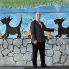 Doug Fraser in front of the George St overbridge mural. PHOTO: PETER MCINTOSH