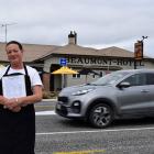 Beaumont Hotel bartender Sarah Omelvena holds a petition calling for safety measures to slow down...