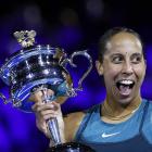 Madison Keys celebrates with the trophy after her victory in the Australian Open final. Photo:...