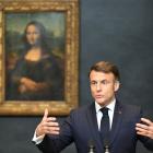 President Emmanuel Macron in front of the Louvre's prize attraction, the Mona Lisa. Photo: Reuters 