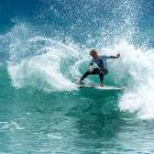 Dunedin surfer Alexis Owen charges to victory in the New Zealand national surfing championships...