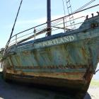 'The Portland' scow languishes in the mud in the Owaka River in Pounawea yesterday. PHOTO:...