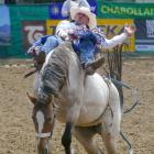 Matt Vermunt, of Invercargill, grits his teeth as he competes in the open bareback finals of the...