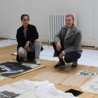Nour Hassan, of New Zealand, and Alex Close, of Canada, from The Kollectiv set up their exhibit...